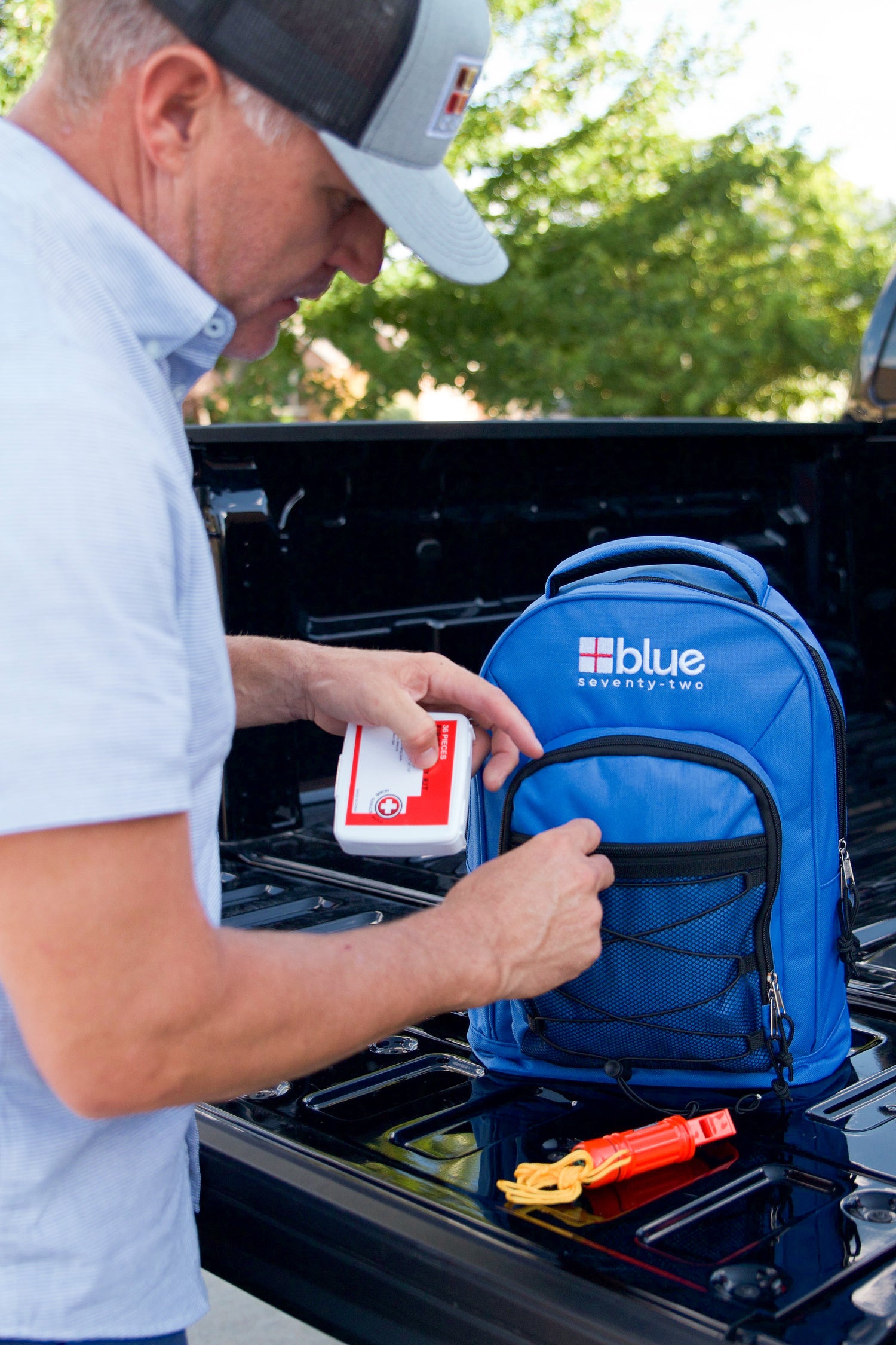 Blue Coolers - Blue Seventy-Two Family Pack - 4 x 3 Day Emergency Kits for 1 Person - Man Showcasing Pack